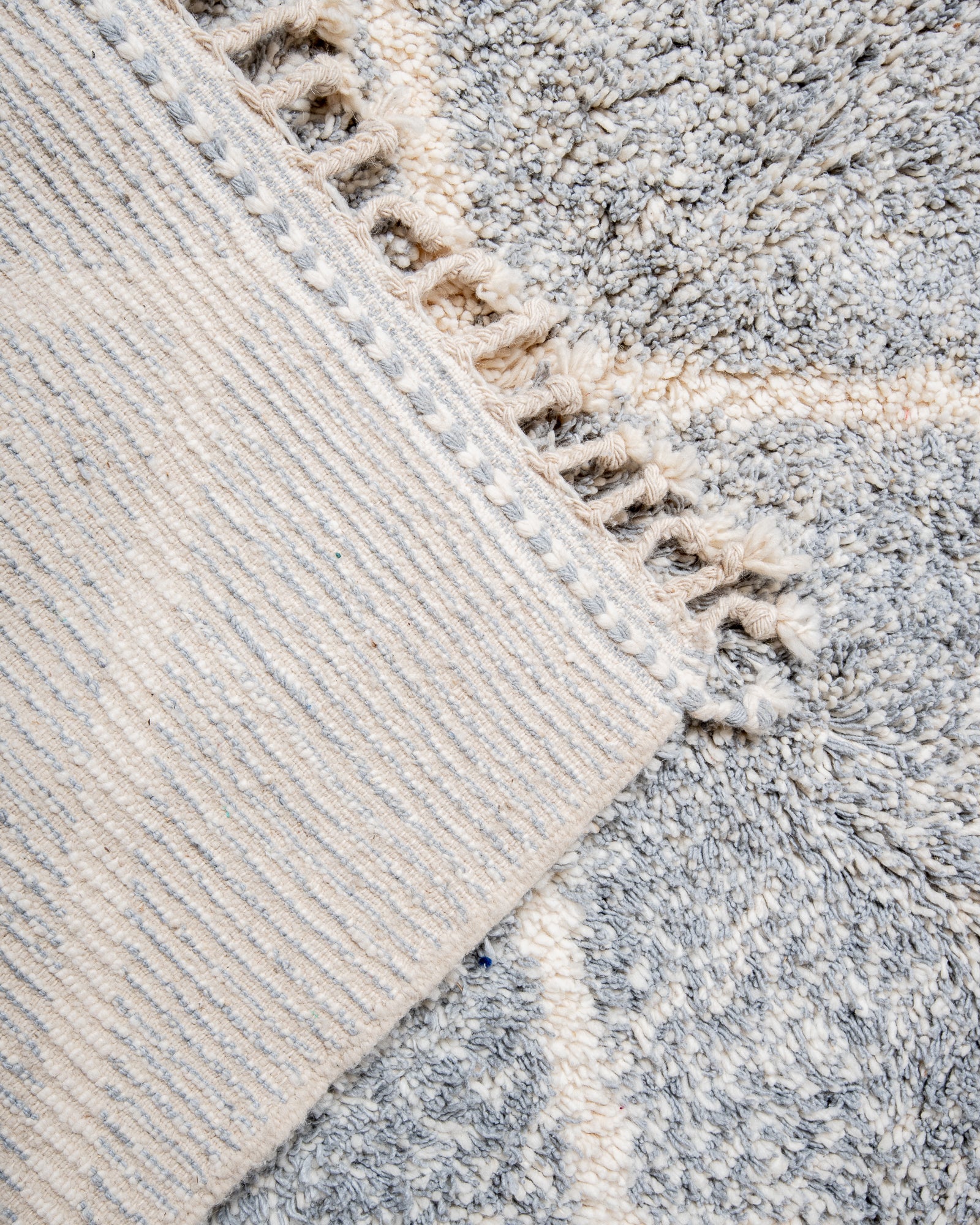 Modern, designer, handcrafted Berber rug from Morocco. Beniourain carpet with beautiful colours and patterns and fluffy wool texture.